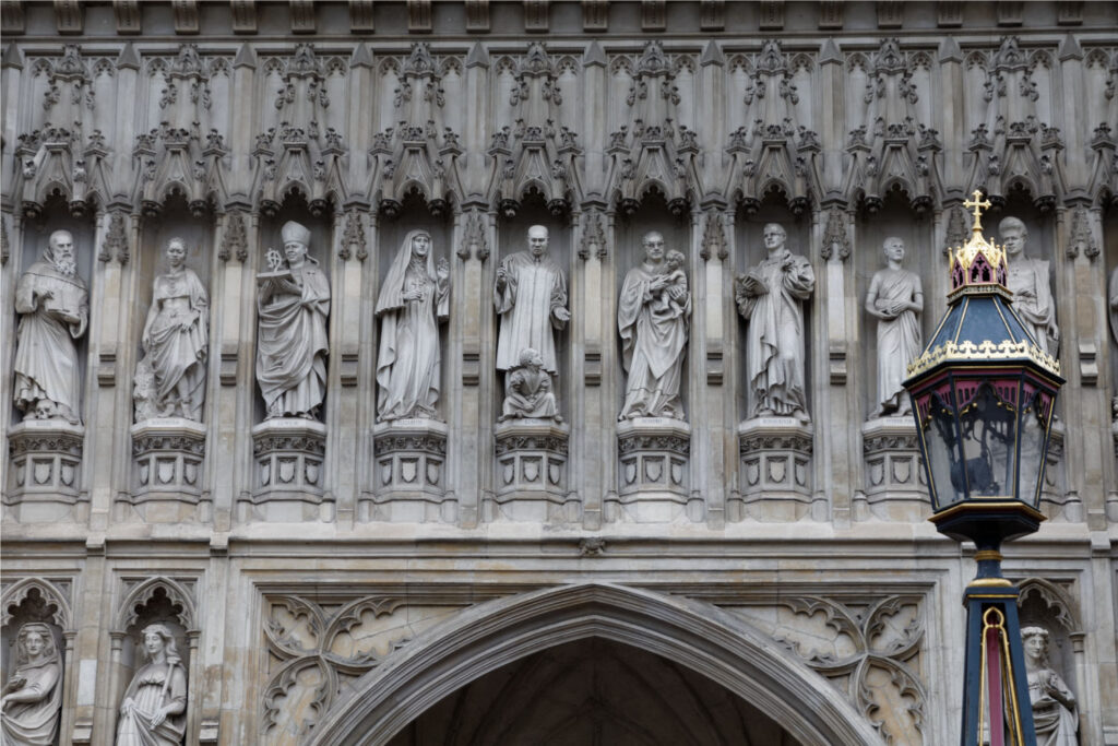 a close up of the statues of 20th century martyrs added to the exterior of Westminster Abbey and unveiled 1998